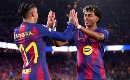 Lamine Yamal celebrates with Raphinha after a Barcelona goal against Newcastle.