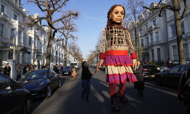 Little Amal outside the Ukrainian embassy in London in March.