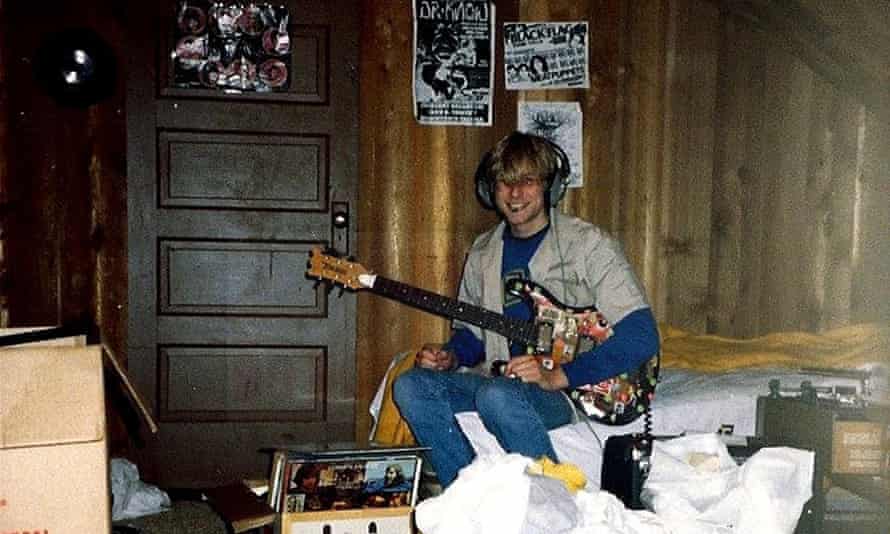 Nirvana’s Kurt Cobain plays guitar in his childhood home in Aberdeen, Wash.
