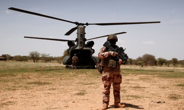 A French soldier in west Africa. Islamist insurgents were blamed for the deaths of 20 victims in Burkina Faso on Friday. 
