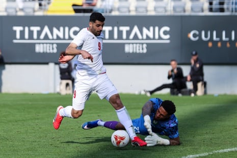 Iran’s Mehdi Taremi (left) attempts to spell past Nigeria’s goalkeeper Maduka Okoye during their friends successful March