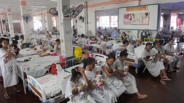 Mothers with their newborn babies at a crowded maternity ward in Manila’s Fabella hospital.