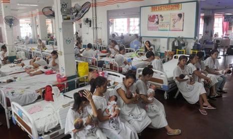 Mothers tend to their newborn babies at a maternity ward at the Dr Jose Fabella Hospital in Manila.