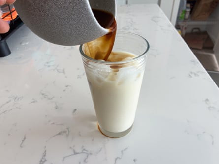 Pouring a cup of coffee that was made with a Moka pot