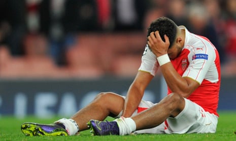 Alex Oxlade-Chamberlain looks dejected after the final whistle.
