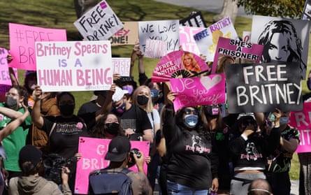 Britney Spears fans hold signs outside the Los Angeles courthouse where the pop singer’s conservatorship hearing was being held on 17 March.