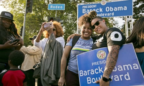 Midori Bastien, second from right, and Jameela Hammond have their photo taken with the newly unveiled Obama Boulevard sign in Los Angeles on Saturday.