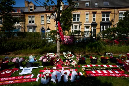 Liverpool fans gather outside Anfield to lay flowers and pay their respects to Diogo Jota