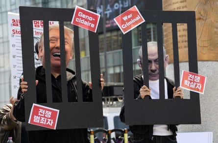 Protesters make it look as if Donald Trump and Netanyahu are in prison, with sign saying ‘war criminal’ on the bars
