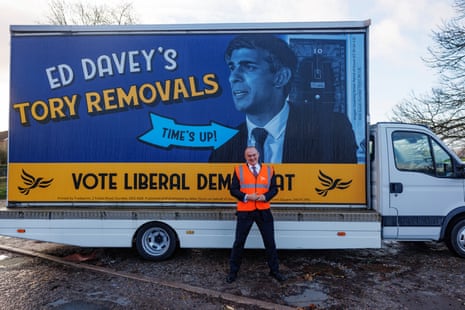 Ed Davey unveiling a new Lib Dem campaign poster.