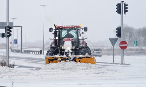A snowplough at work in Aalborg, Denmark, on 4 January