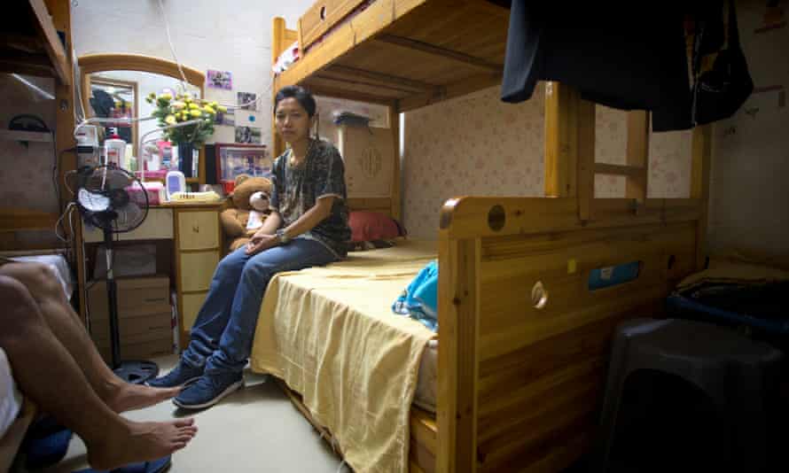 Roy Wardha sits on bunk bed in apartment she shares with 11 others in Macau’s Sam Can Tang neighbourhood