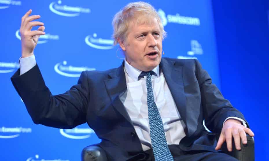 Boris Johnson waves one hand in the air during the Swiss Economic Forum meeting on 24 May.