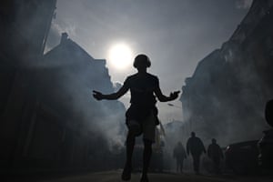 A man dances during a demonstration in Mulhouse, on the eighth day of strikes and protests across the country