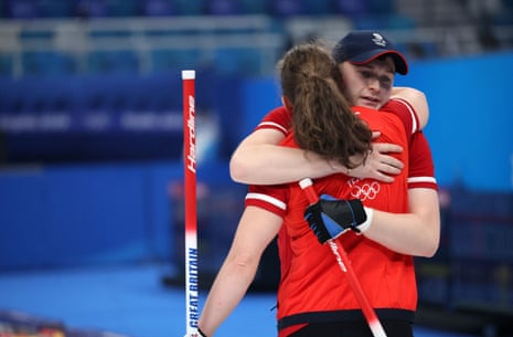 Jen Dodds of Britain and Bruce Mouat of Britain react after losing the game.