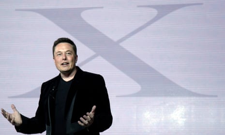 Elon Musk in front of X sign