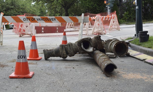 Unearthed pipes lie on Vancouver’s East 12th Avenue, which is undergoing construction to replace a water main on 14 July 2019.