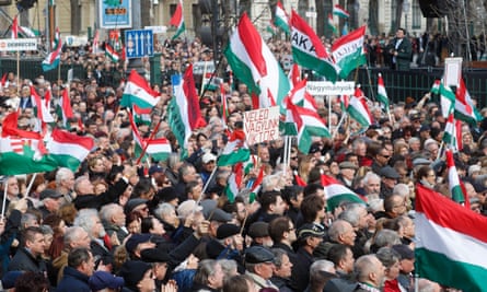 People gather to watch Hungary’s populist prime minister Viktor Orban deliver a speech in Budapest. The uneven progress from communism to capitalism is believed to have sowed the seeds of populism that is currently strengthening in central Europe.