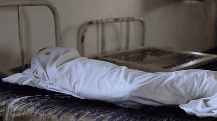 A assemblage wrapped successful a expanse connected a metallic bedframe