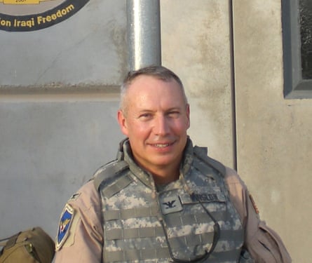 A middle-aged man in combat gear.