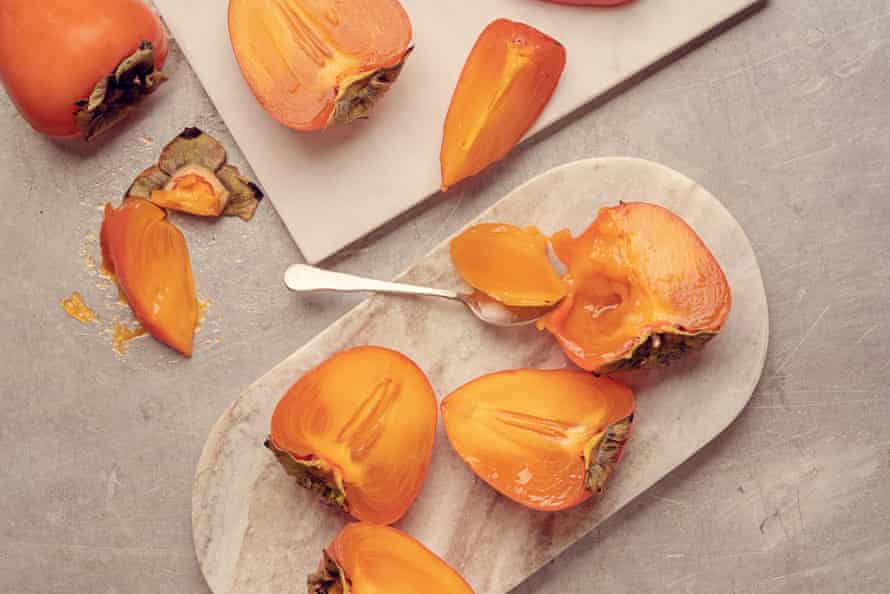 A ripe astringent persimmon, with jelly-soft flesh and translucent skin.