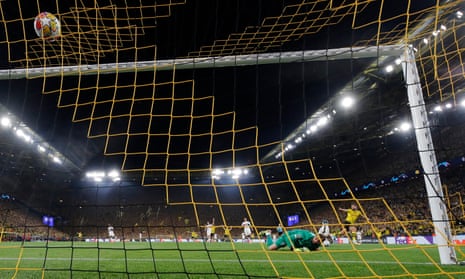 Borussia Dortmund's Niclas Füllkrug scores their first goal past Paris St Germain's keeper Gianluigi Donnarumma.