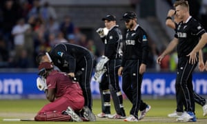 New Zealand players console Carlos Brathwaite after his swing for six runs to win the game was caught by Trent Boult.