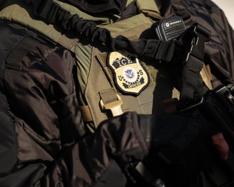 A federal agent's uniform showing an ICE badge