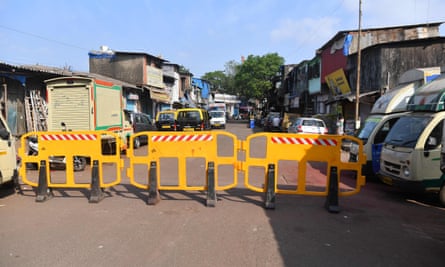 Barriers on a road leading to a quarantined area inside the Dharavi slum