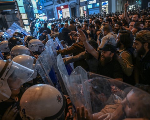 Demonstrators clash with anti-riot police in Istanbul after gathering over a cartoon allegedly of the prophet Muhammad
