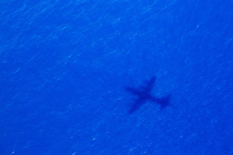 The shadow of a search plane scouring the Indian Ocean for debris in April 2014