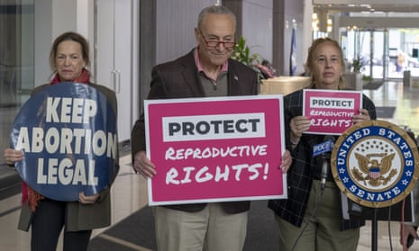 Chuck Schumer with abortion rights activists in New York on Sunday.