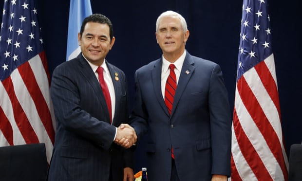 Jimmy Morales and Mike Pence at a summit in Miami last week. Several members of Barnes &amp; Thornburg have worked for the vice-president in the past.