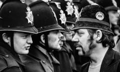 A striking miner faces a line of police at the Orgreave coking plant during the miners’ strike, June 1984