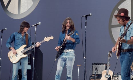 Glenn Frey, centre, with Randy Meisner, left, and Bernie Leadon performing with the Eagles on the Helen Reddy Show, 1973. 
