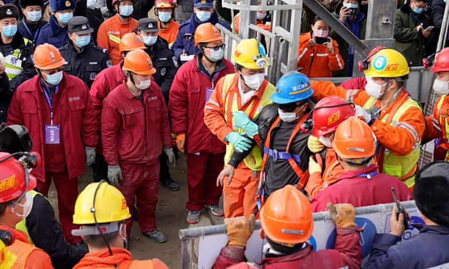 One of the miners being led away after being rescued.