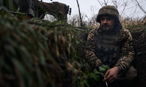 A Ukrainian soldier prepares to open fire from a trophy AGS-17 on 27 October, in the Bakhmut district of Ukraine.