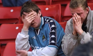 A pair of City fans sit in despair at Stoke City’s Britannia Stadium after the club were relegated to Division Two in May 1998.