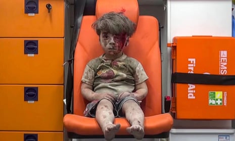 In this still taken from video provided by Aleppo Media Centre, a child sits in an ambulance apparently after being pulled out of a building hit by an airstrike.