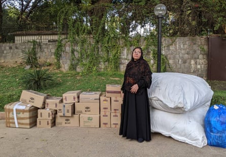Amina Khatoun, with some of the aid she bought by trading in a gold bracelet, kept for family emergencies.