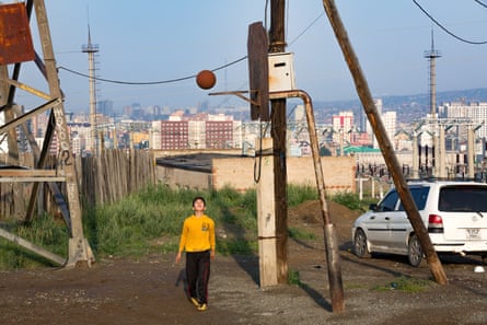 A boy plays basketball in the Bayanzürkh district of Ulaanbaatar