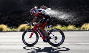 Go hard, go iron: a rider cools off in last year’s Kona triathlon.