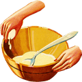 Hands crack an egg into a bowl