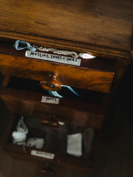 Baby clothes in a drawer