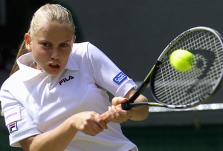Jelena Dokic plays a backhand at Wimbledon in 2001