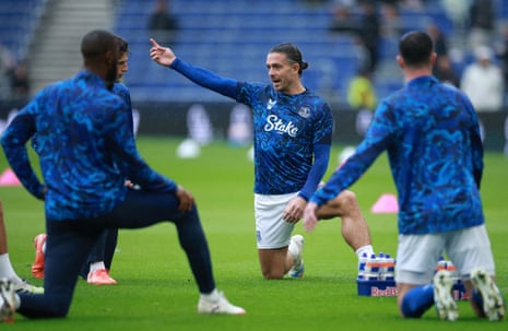 Jack Grealish talks to his teammates