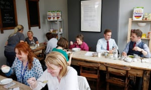 Customers at the Saltaire Canteen, Saltaire, Yorkshire, one of the many Real Junk Food cafes nationwide. Diners pay whatever they feel the food is worth.