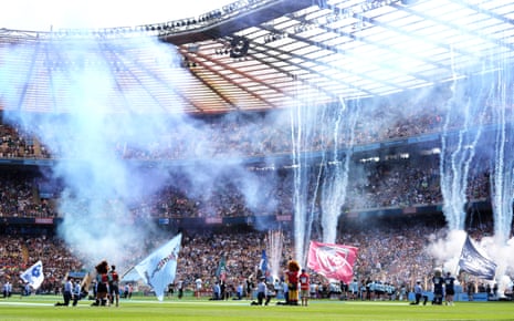 Bath Rugby and Leicester Tigers players run onto the field as pyrotechnics go off ahead of the Gallagher Premiership Rugby final.