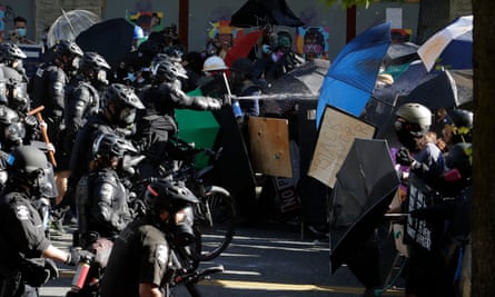 Police pepper-spray Black Lives Matter protesters in Seattle, Washington, on 25 July 2020.