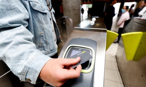 A commuter uses their Myki card at Melbourne's Flinders Street station